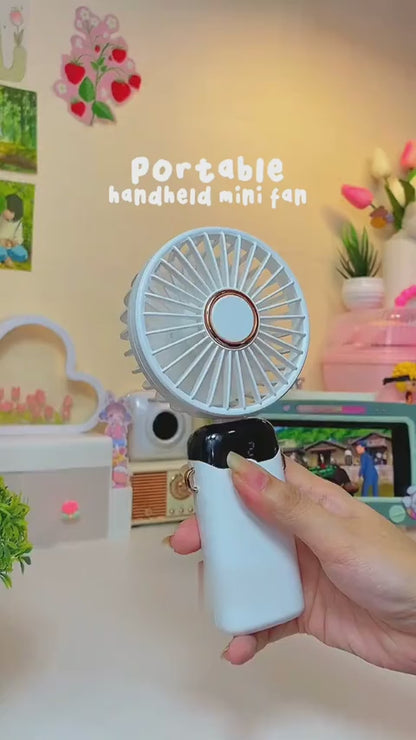 Digital Display Portable Mini Fan – 5-in-1 USB-C Rechargeable Handheld Fan With Phone Stand (Random Color)